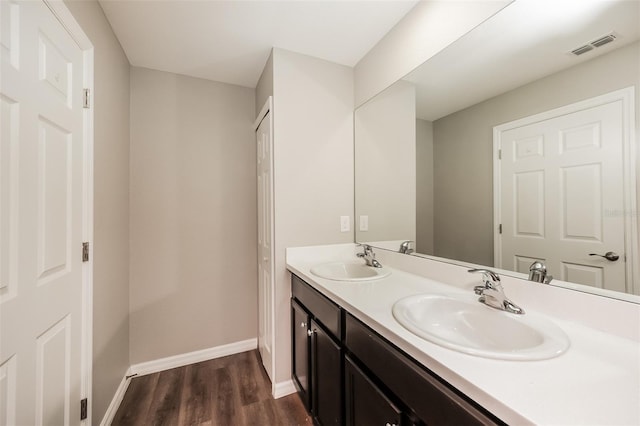 bathroom with vanity and hardwood / wood-style floors