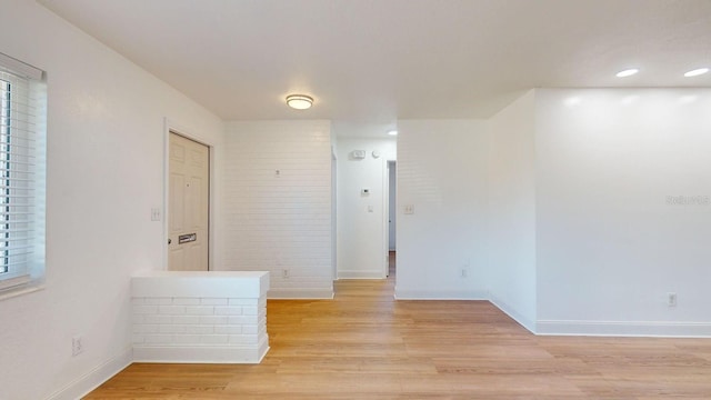 spare room featuring light wood-type flooring