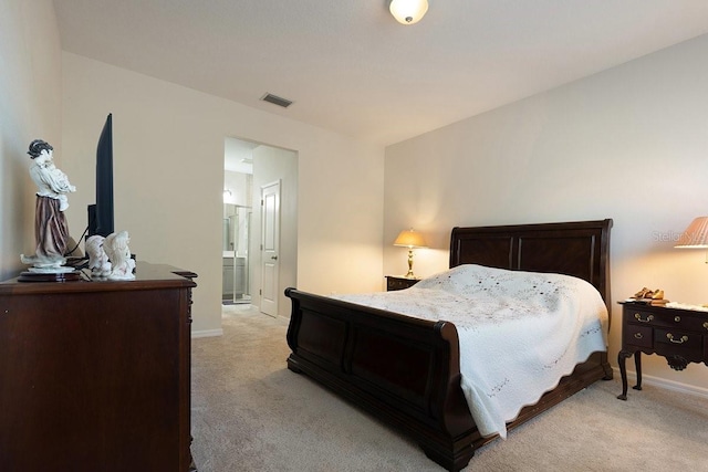 bedroom featuring baseboards, visible vents, and light colored carpet