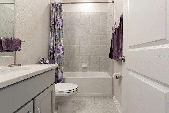 full bathroom with vanity, tile patterned flooring, toilet, and shower / tub combo with curtain