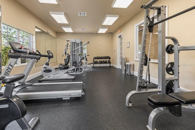 gym featuring visible vents and baseboards