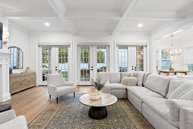 sunroom / solarium featuring coffered ceiling, beam ceiling, french doors, and a chandelier