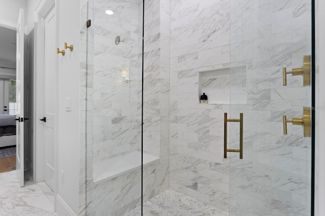 bathroom with a shower with shower door