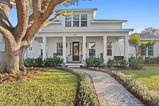 view of front of house featuring a porch and a front yard