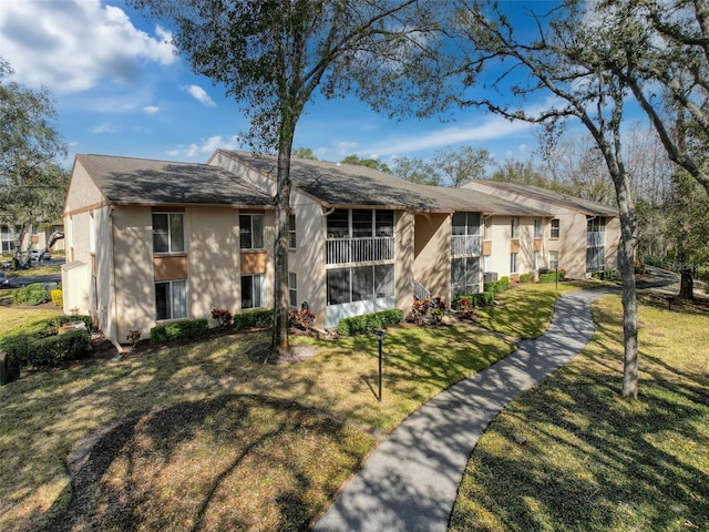 ranch-style home featuring a front lawn