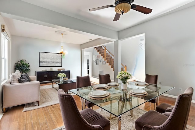 dining room featuring hardwood / wood-style flooring and ceiling fan