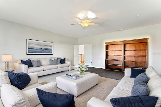 living room featuring ceiling fan and carpet floors