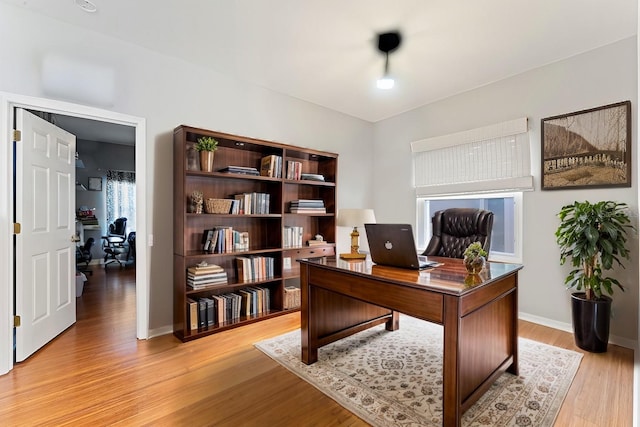 office area with light hardwood / wood-style flooring