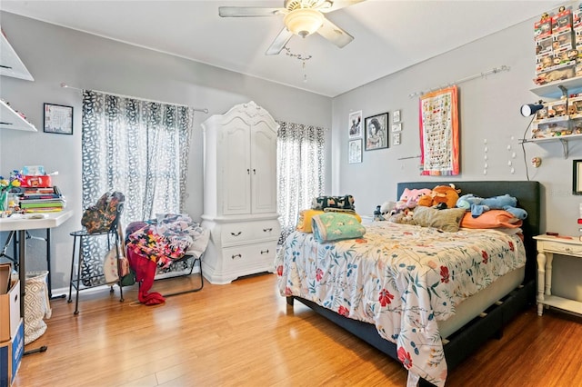 bedroom with wood-type flooring and ceiling fan