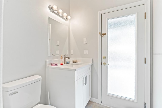 bathroom with vanity and toilet