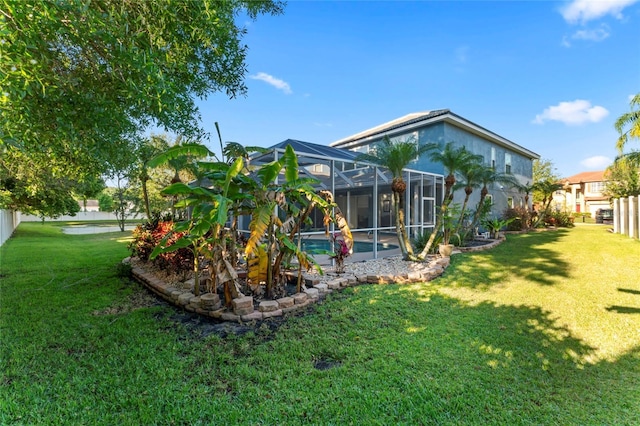 view of yard with glass enclosure