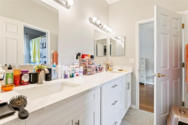 bathroom with vanity and tile patterned flooring