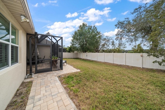 view of yard featuring a lanai and a patio