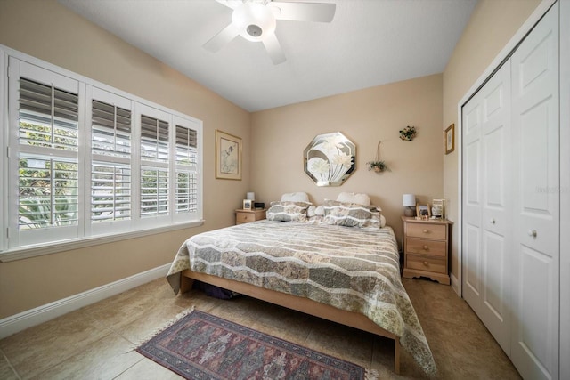 bedroom with ceiling fan and a closet