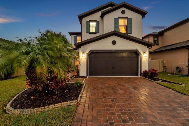 mediterranean / spanish-style home featuring a garage