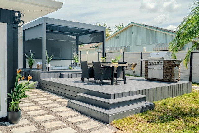 wooden terrace featuring outdoor dining space, a lanai, and area for grilling