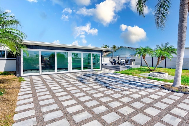 exterior space featuring fence and a fire pit