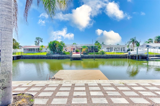 dock area featuring a water view and a residential view