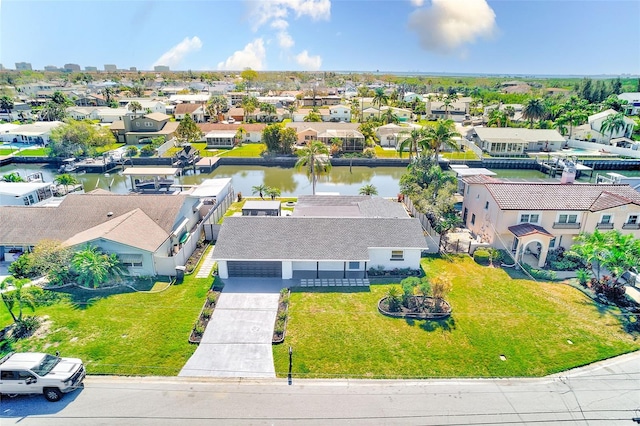 bird's eye view with a residential view and a water view