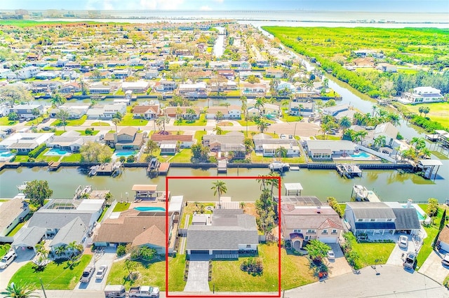 birds eye view of property featuring a residential view and a water view