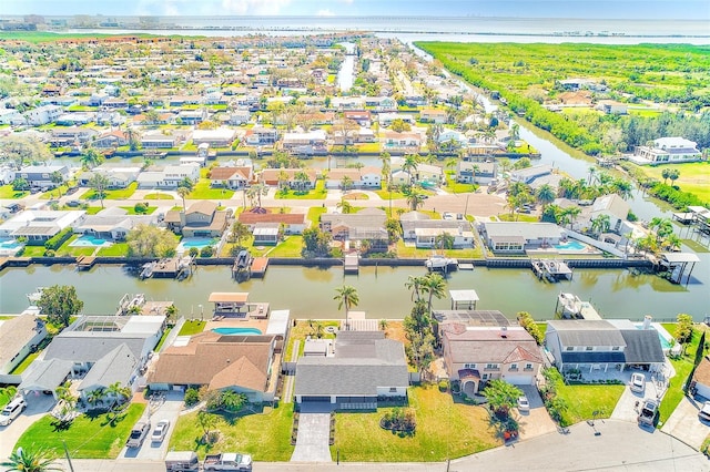 drone / aerial view with a water view and a residential view