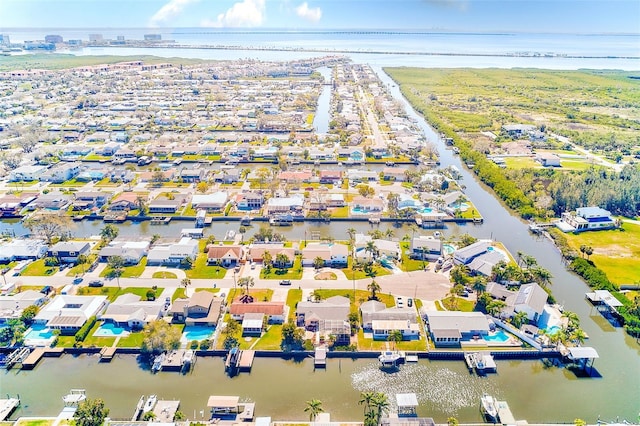 bird's eye view featuring a water view and a residential view