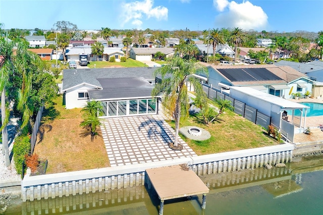 bird's eye view featuring a water view and a residential view