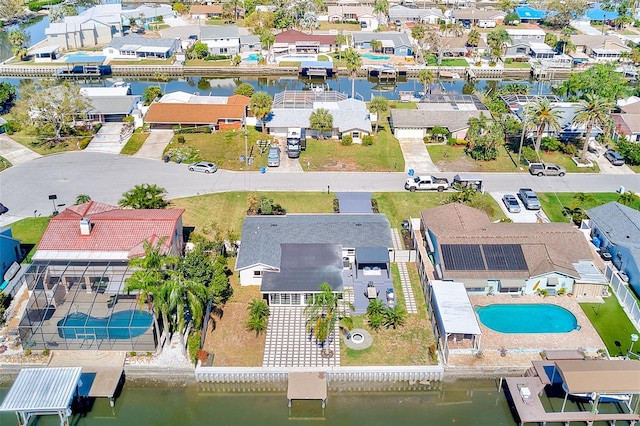 bird's eye view featuring a water view and a residential view