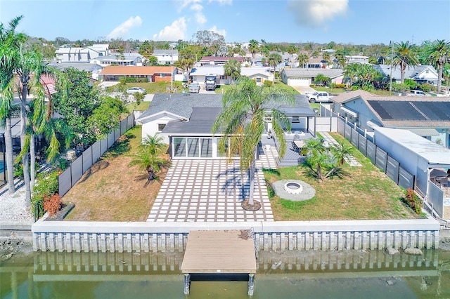 bird's eye view with a water view and a residential view