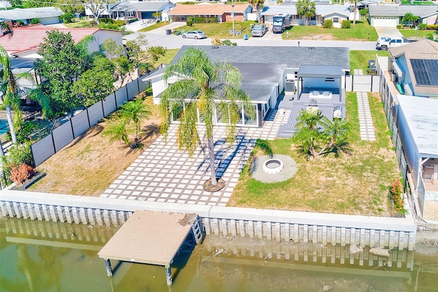 birds eye view of property featuring a residential view and a water view