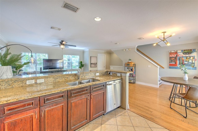 kitchen featuring sink, crown molding, and dishwasher