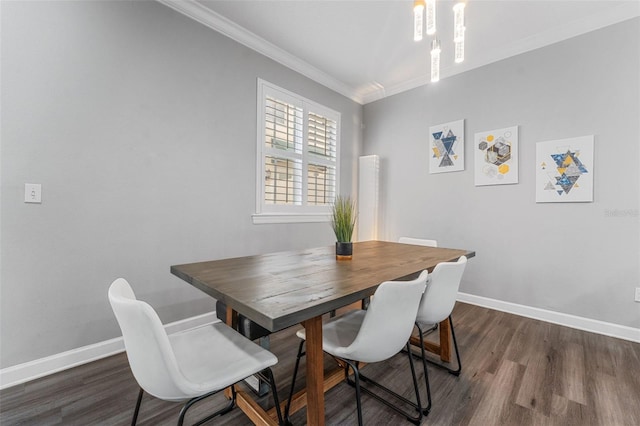 dining space featuring dark wood-type flooring and ornamental molding