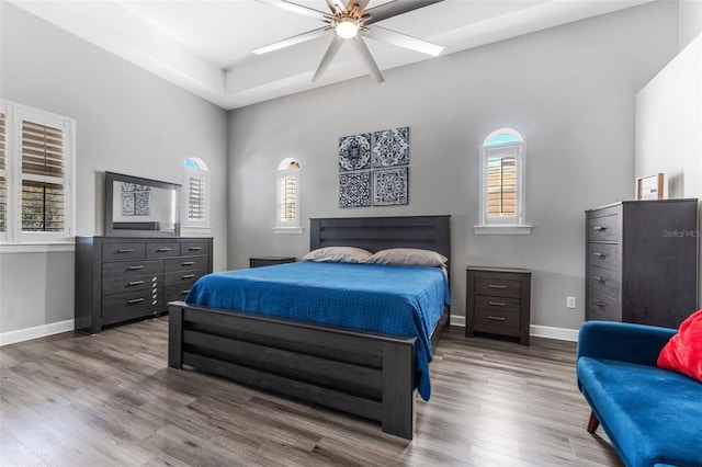 bedroom featuring wood-type flooring and ceiling fan