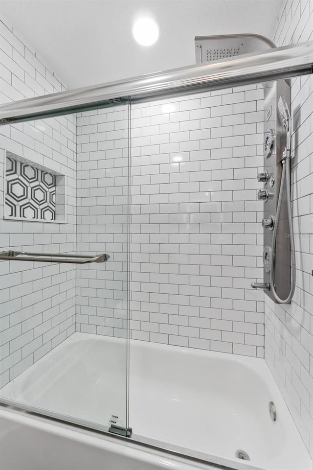 bathroom featuring enclosed tub / shower combo