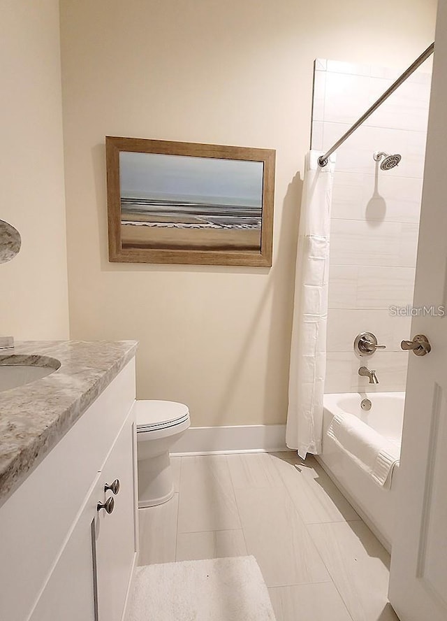 full bathroom featuring vanity, shower / bath combination with curtain, and toilet