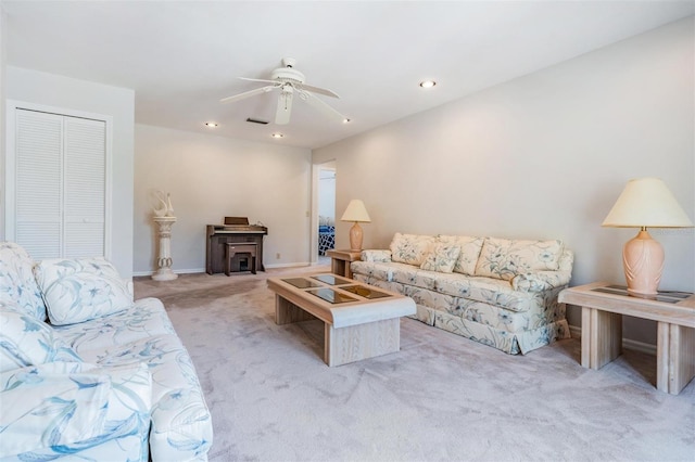 living room with light colored carpet and ceiling fan