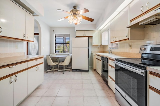 kitchen with white cabinetry, white fridge, black dishwasher, and stainless steel electric range