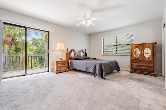 carpeted bedroom featuring ceiling fan and access to exterior