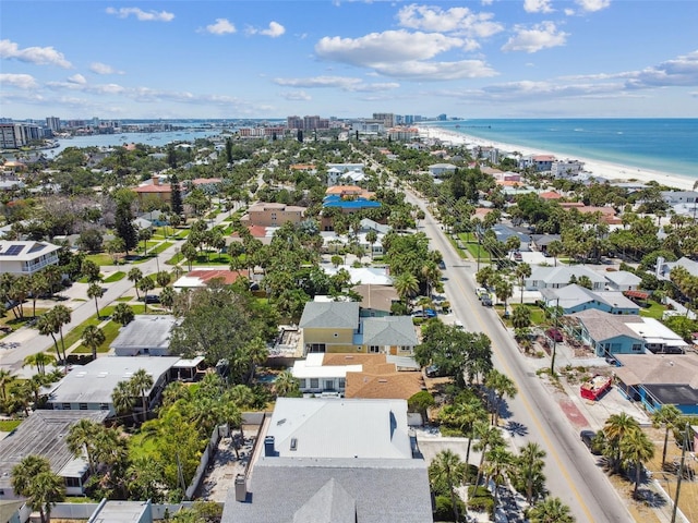 bird's eye view featuring a water view and a beach view