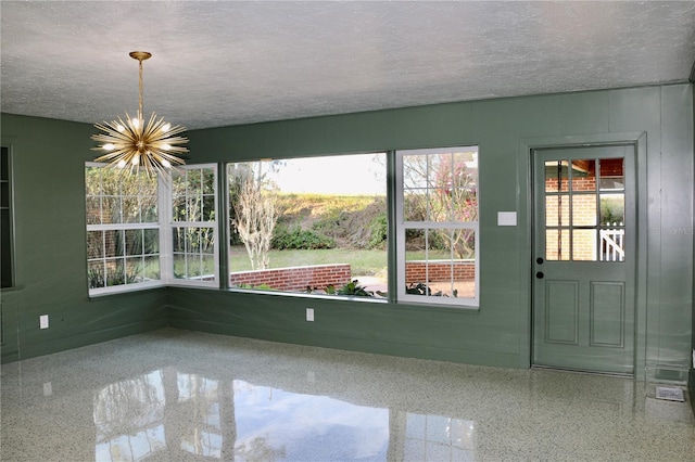 interior space featuring a chandelier