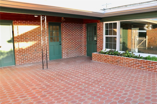 entrance to property with a patio area