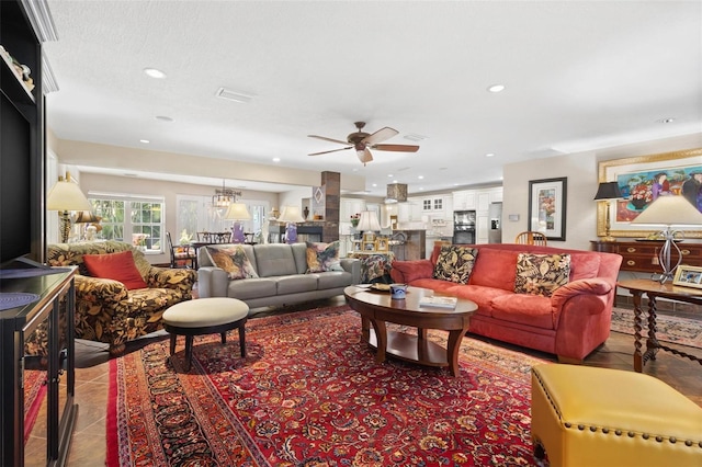 tiled living room featuring ceiling fan