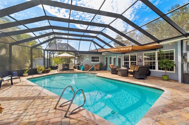 view of pool with a lanai, a patio area, and outdoor lounge area