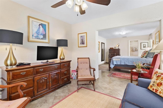 bedroom featuring light tile patterned floors and ceiling fan