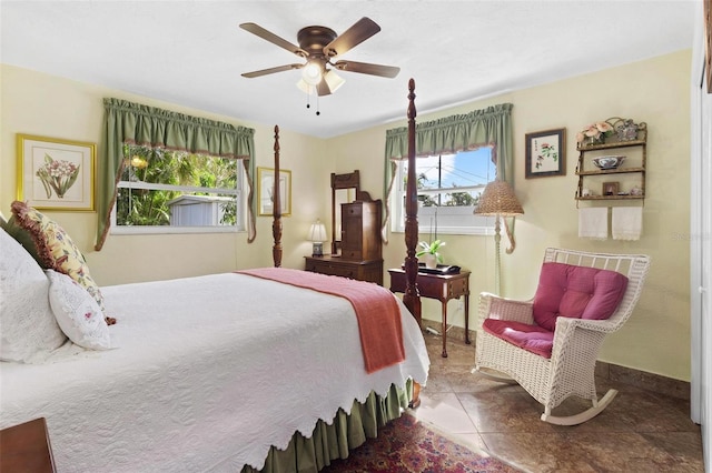 tiled bedroom featuring ceiling fan