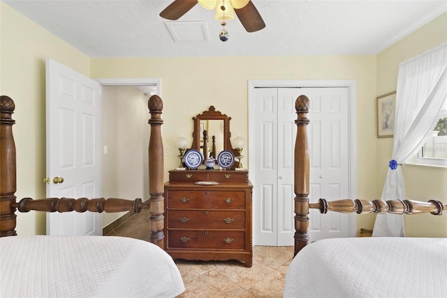 tiled bedroom with a closet and ceiling fan