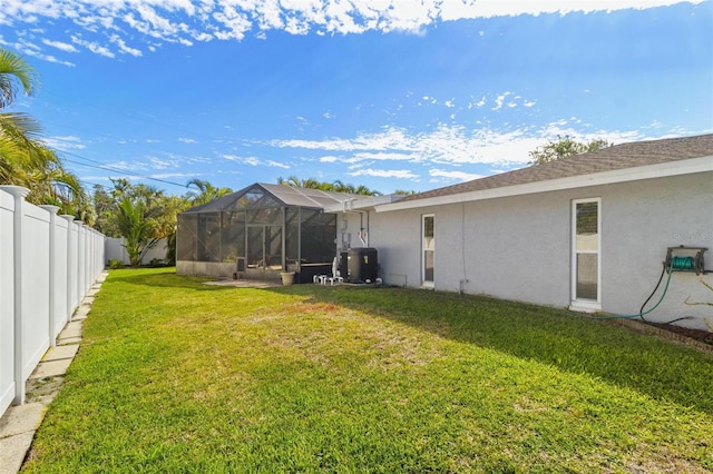 view of yard featuring glass enclosure