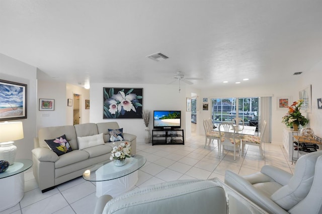 tiled living room featuring ceiling fan