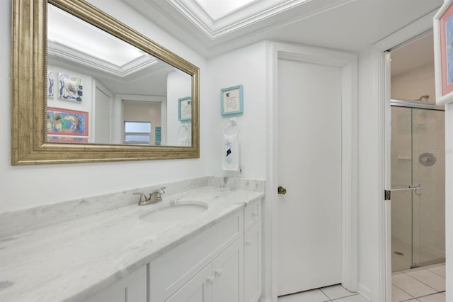 bathroom with vanity, tile patterned floors, crown molding, and a shower with shower door