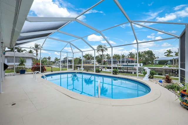 view of pool with a lanai and a patio